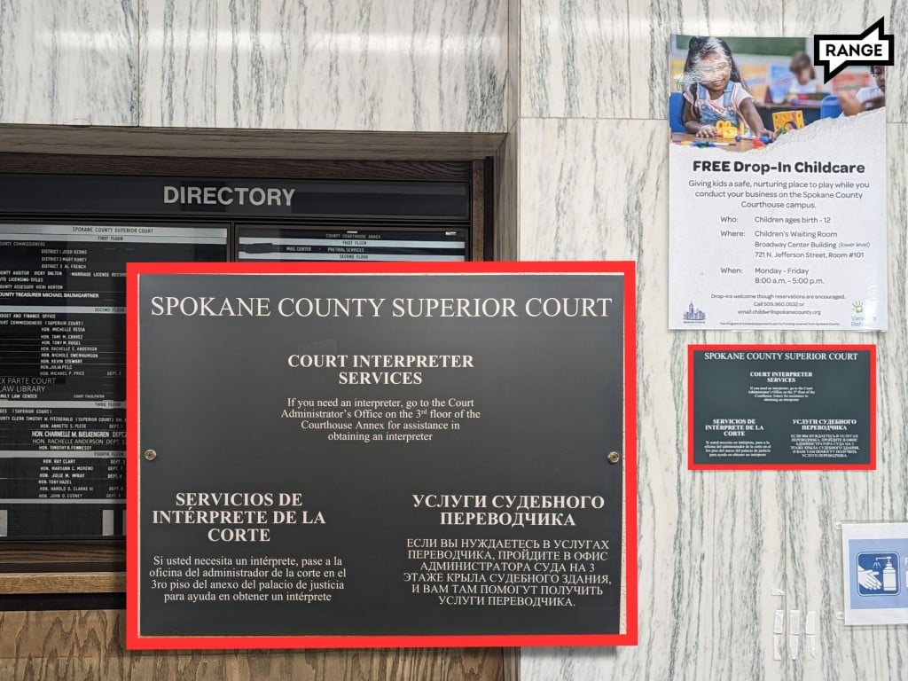 A photo of a small sign for language access options in the Spokane County Courthouse says "Spokane County Superior Court; Court Interpreter Services; If you need an interpreter, go to the Court Administrator's Office on the 3rd floor of the Courthouse Annex for assistance in obtaining an interpreter" It repeats the information in Spanish and Russian. 